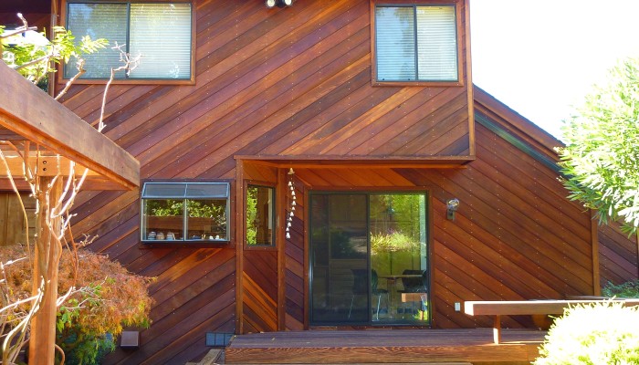 Redwood walls after cleaning and treating