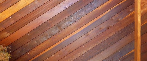 Redwood walls after cleaning and treating