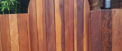 Redwood fence after staining